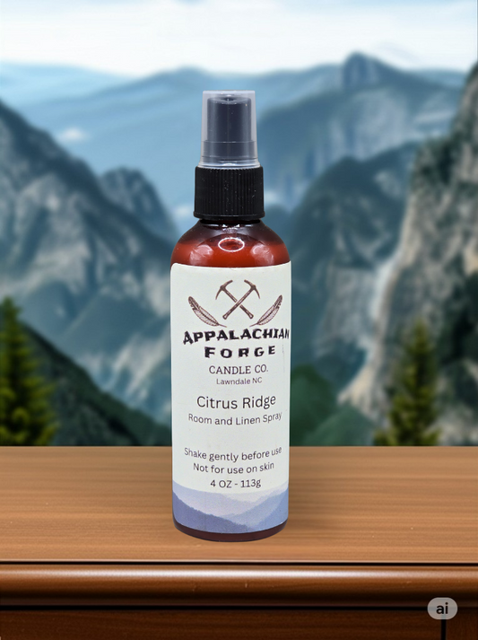 Citrus Ridge room and linen spray bottle from Appalachian Forge Candle Co. on wooden surface with mountain background